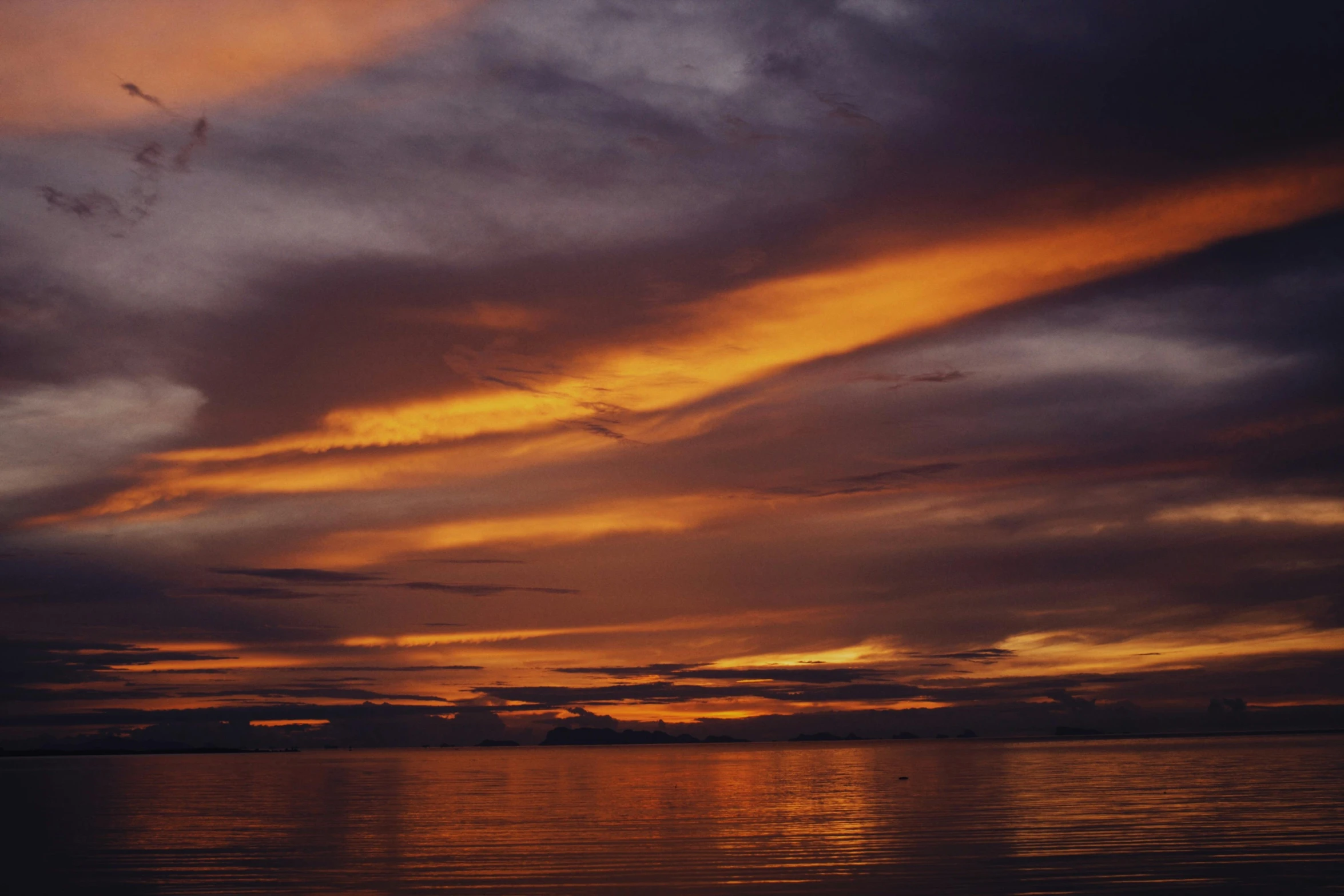 a sunset that is reflected in the water