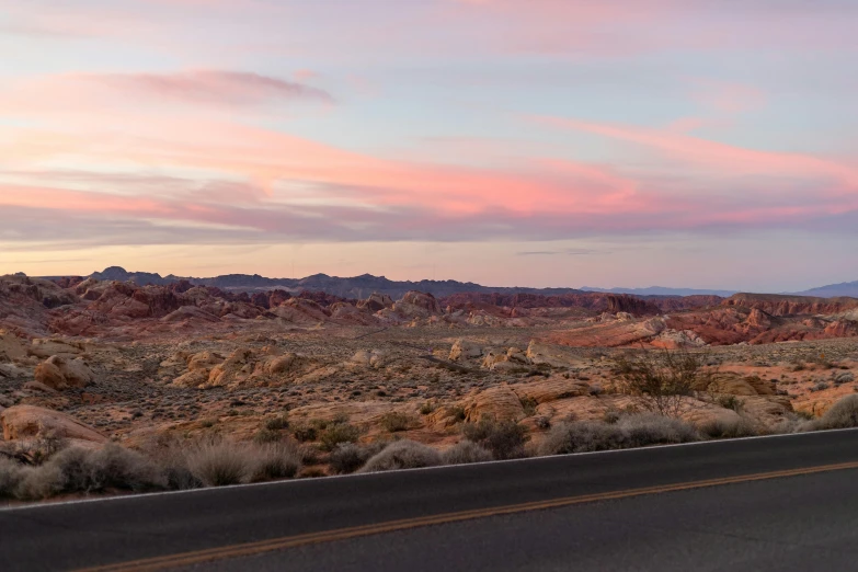 a truck driving down the highway in the desert