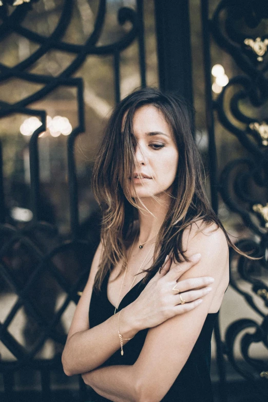 a beautiful young woman in a black dress