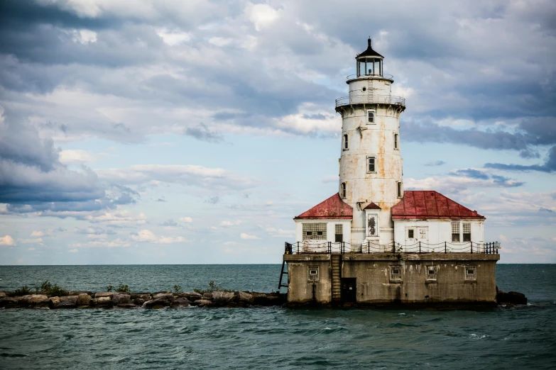 a large light house on top of a body of water