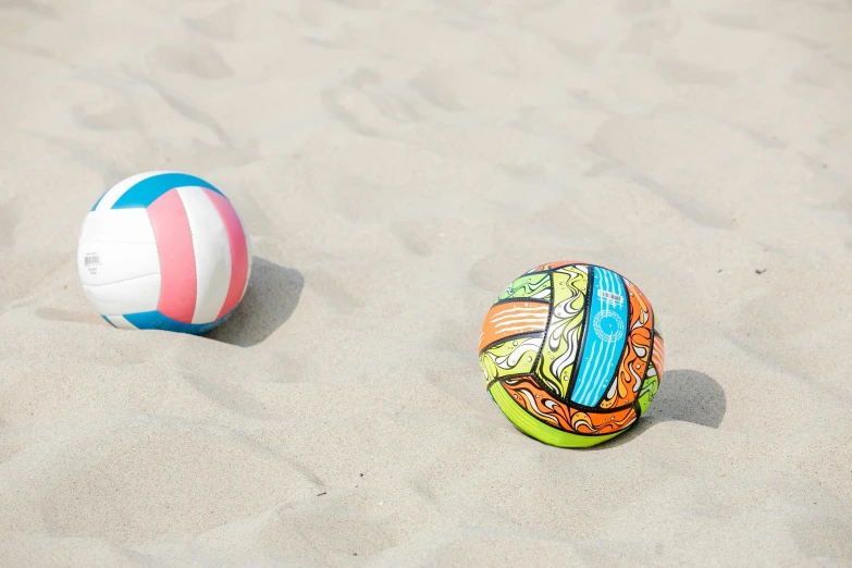 two beach ball in the sand on the beach