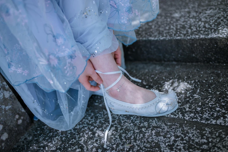 the feet of two people wearing shoes near each other