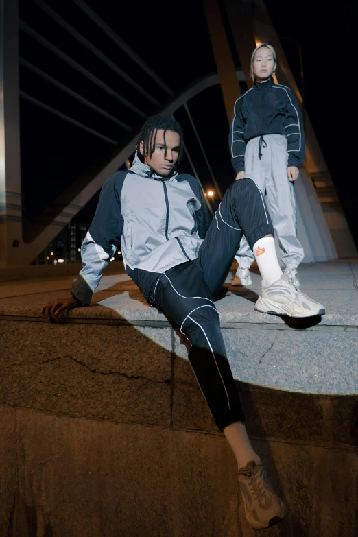 two skateboarder in matching outfits at night outside