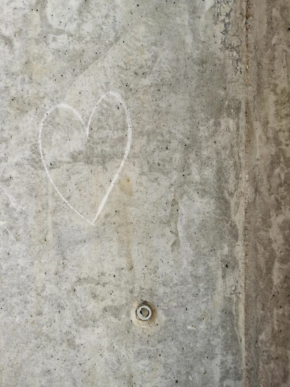 a picture of a heart painted on the concrete