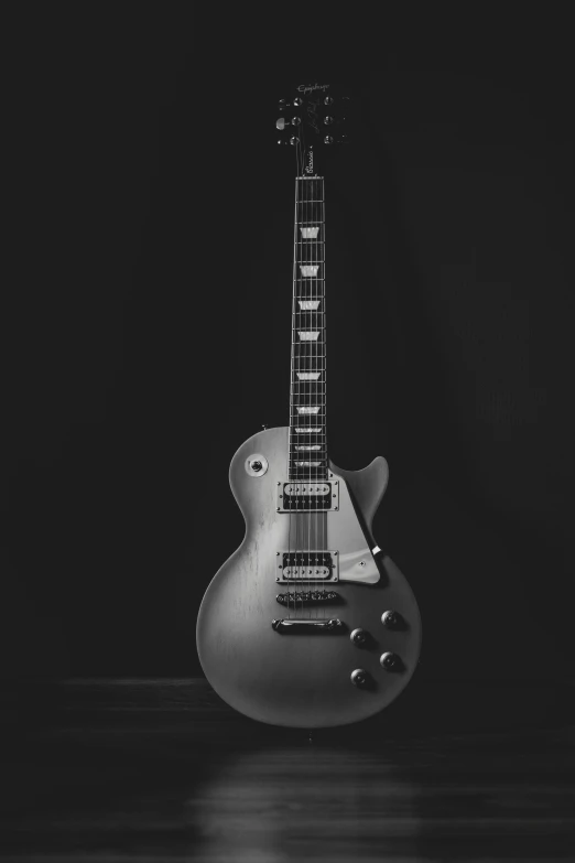 a black and white po of a guitar