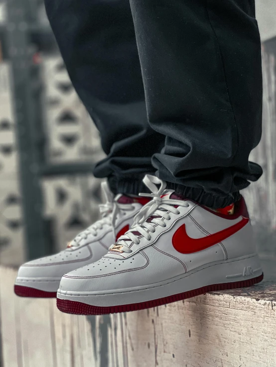 a close up view of the red nike air force sneakers