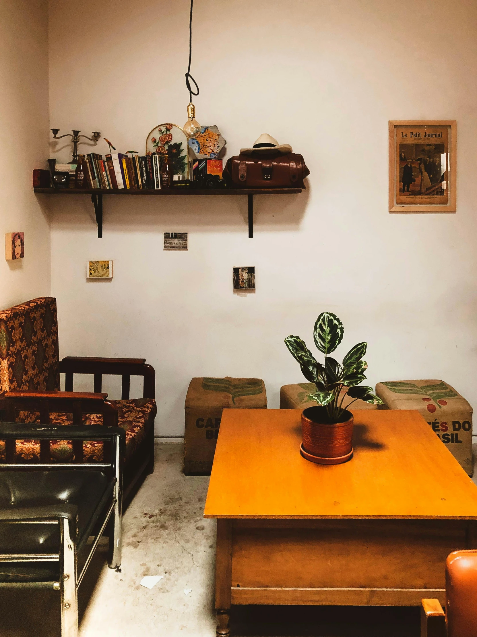 a room with a table, couch and book shelf