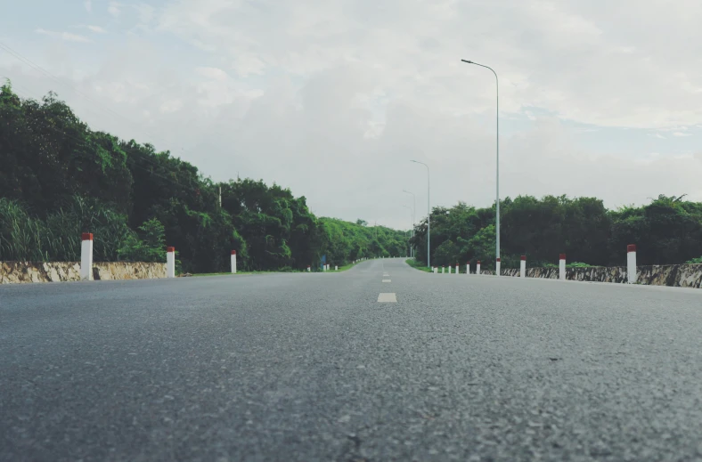 a street with cars driving down the road