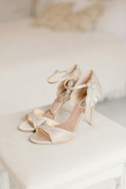 a pair of beige high heeled wedding shoes