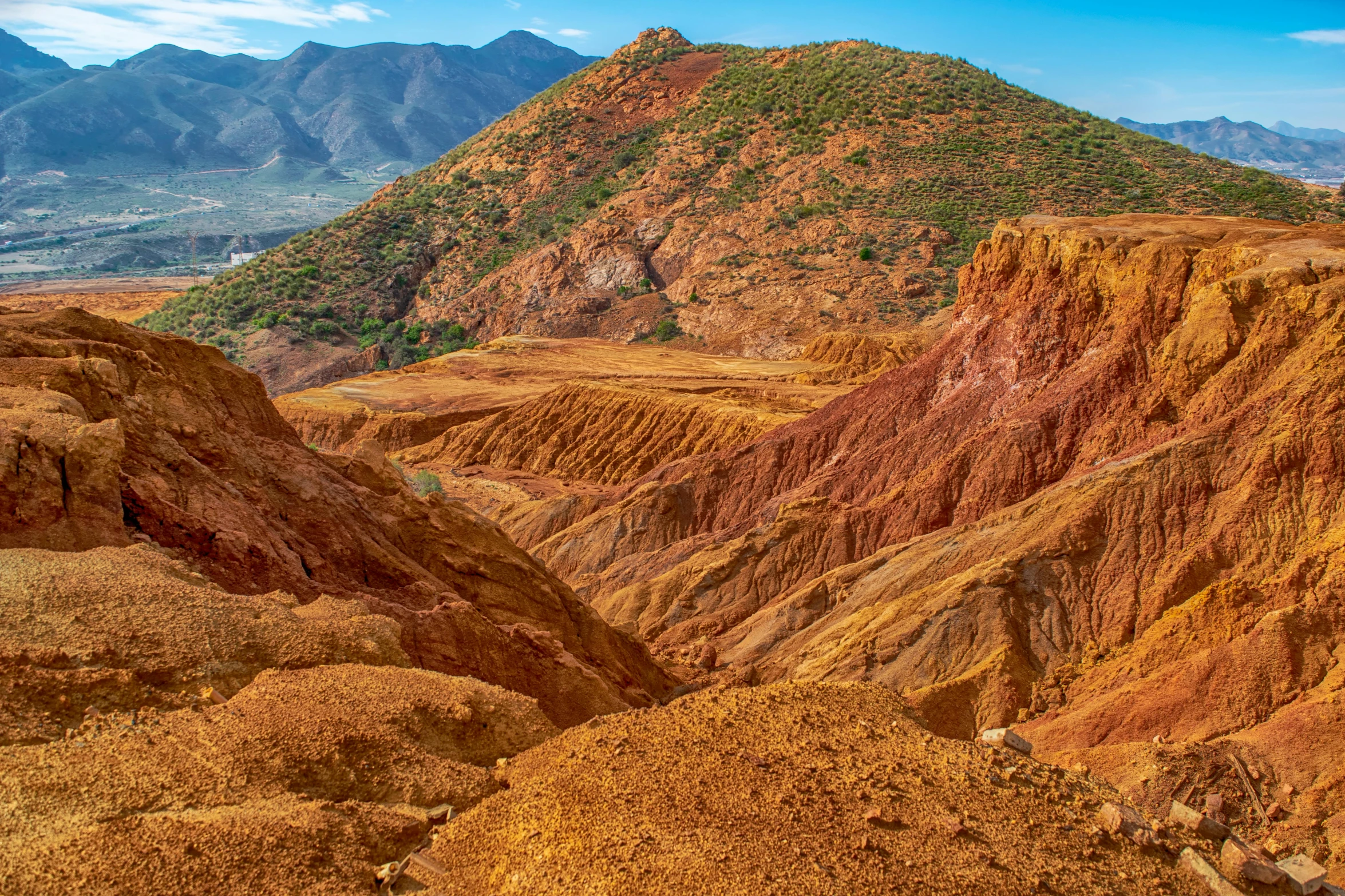 view of the colorful mountains with mountain tops in the background