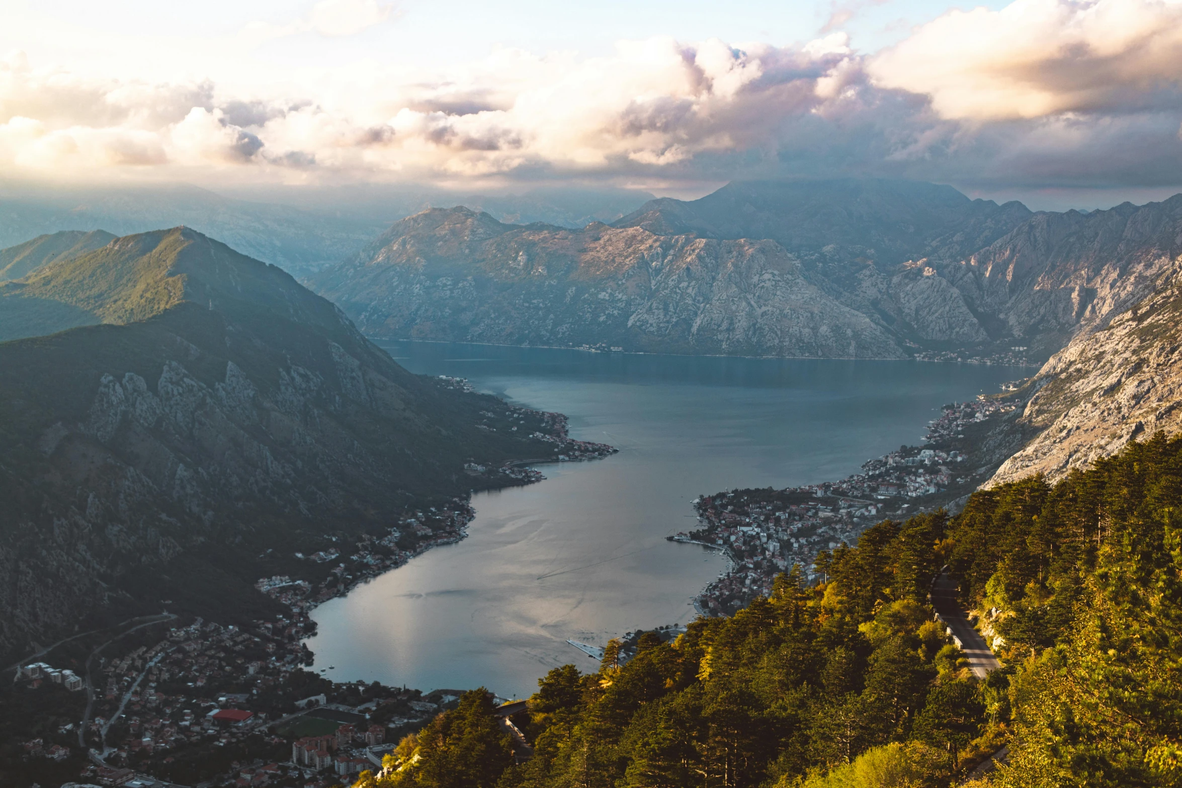 a view of a beautiful blue lake surrounded by mountains