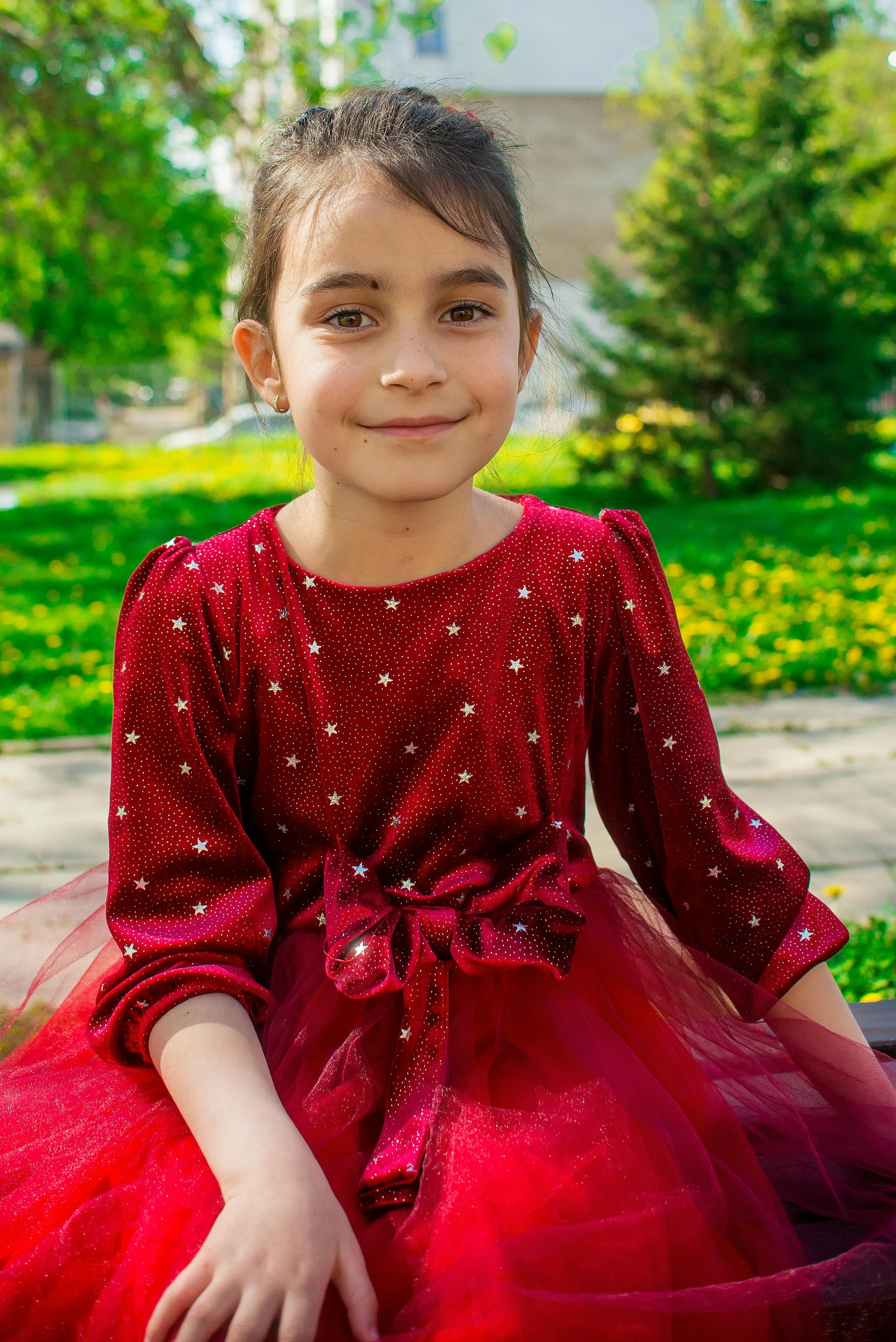 a little girl that is wearing a dress