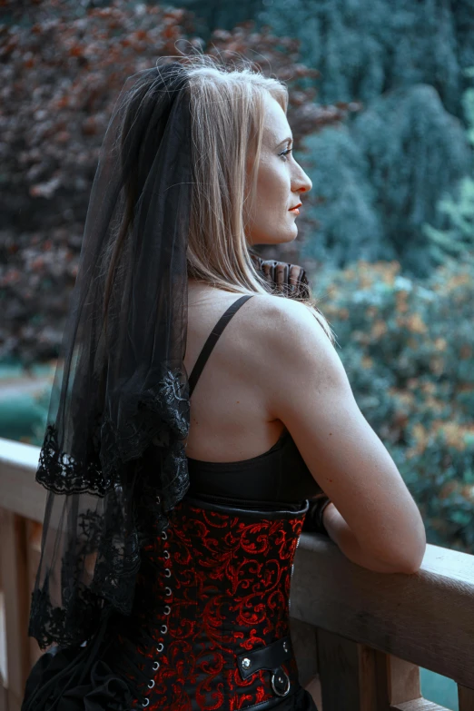 the back of a woman with a red corset on