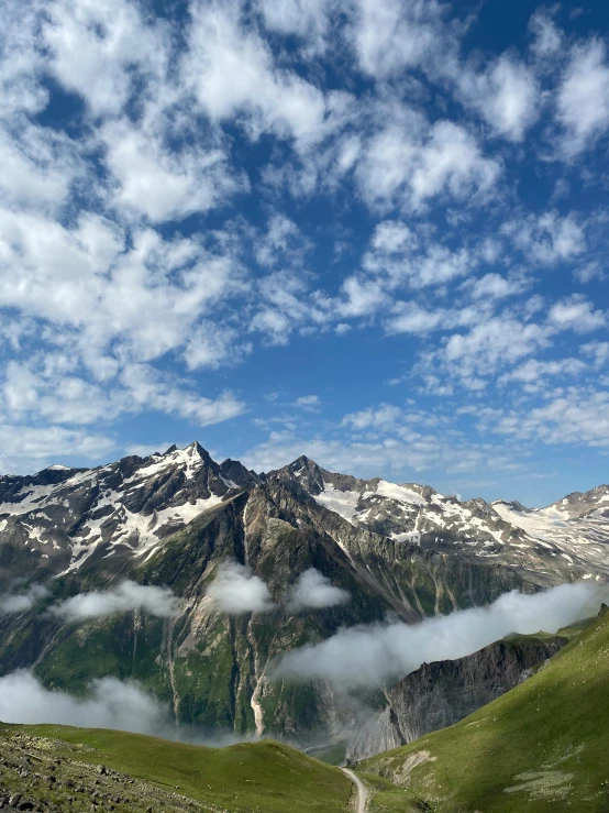 the mountain tops are covered in low cloud