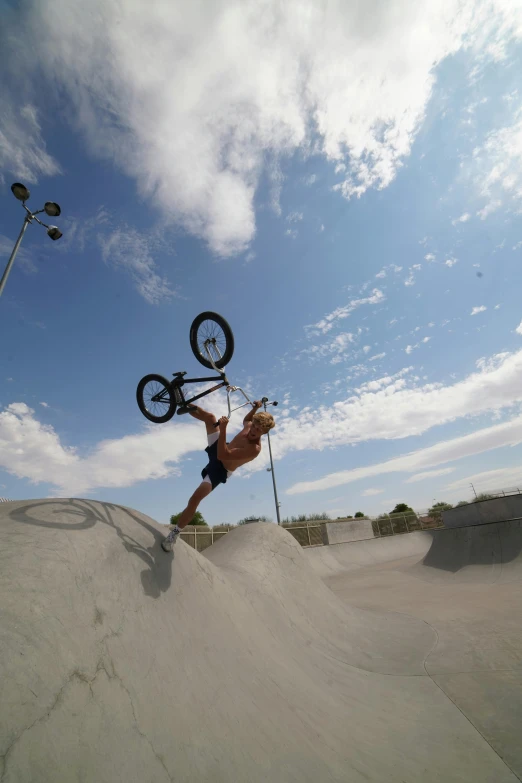 a man on a dirt bike is performing a trick