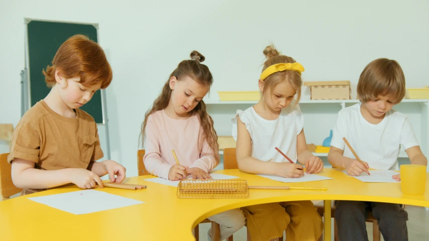 children are doing their homework in a school room