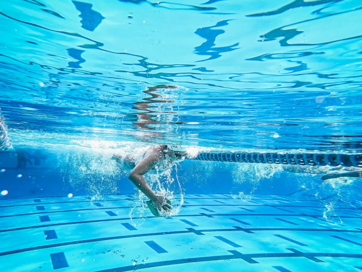 the swimmer is getting ready to dive in the water