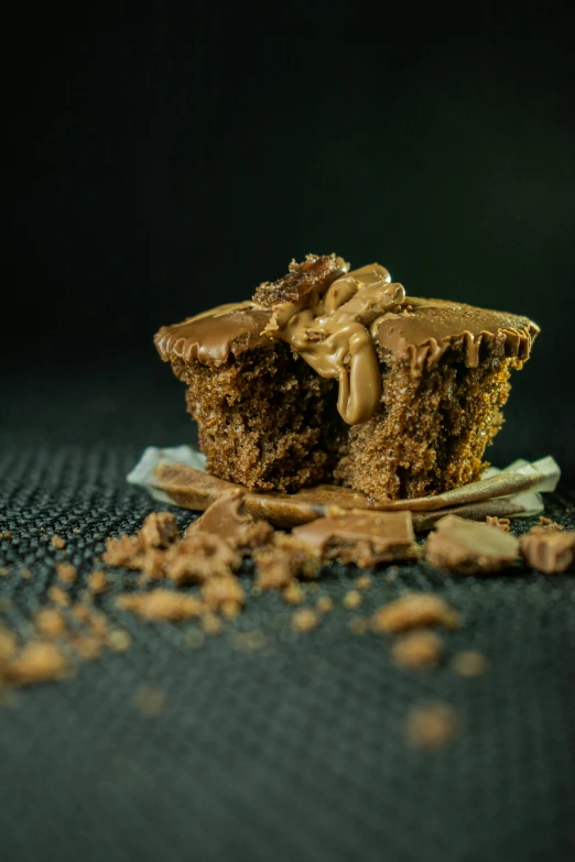 there is a piece of brownie sitting on top of a blue surface