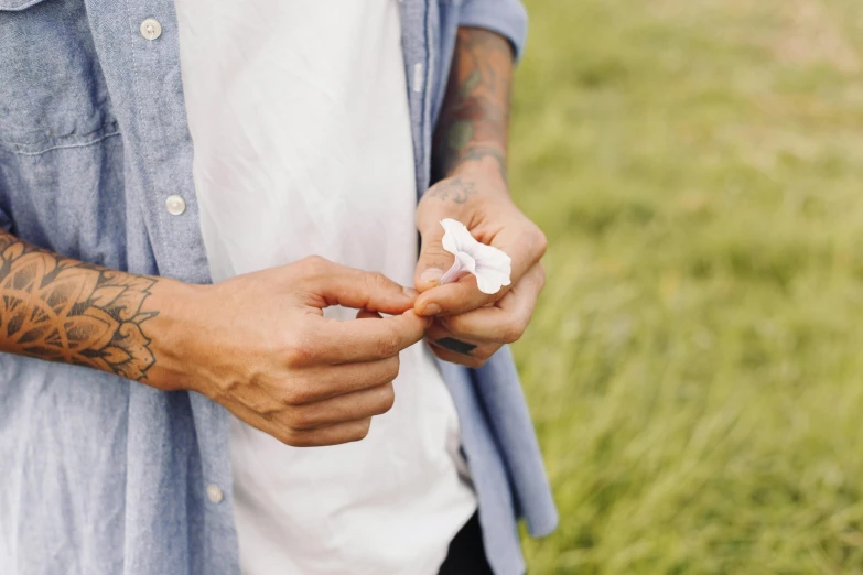 a close up of a person holding soing in their hands