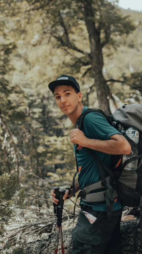 a man wearing a backpack with a large bag