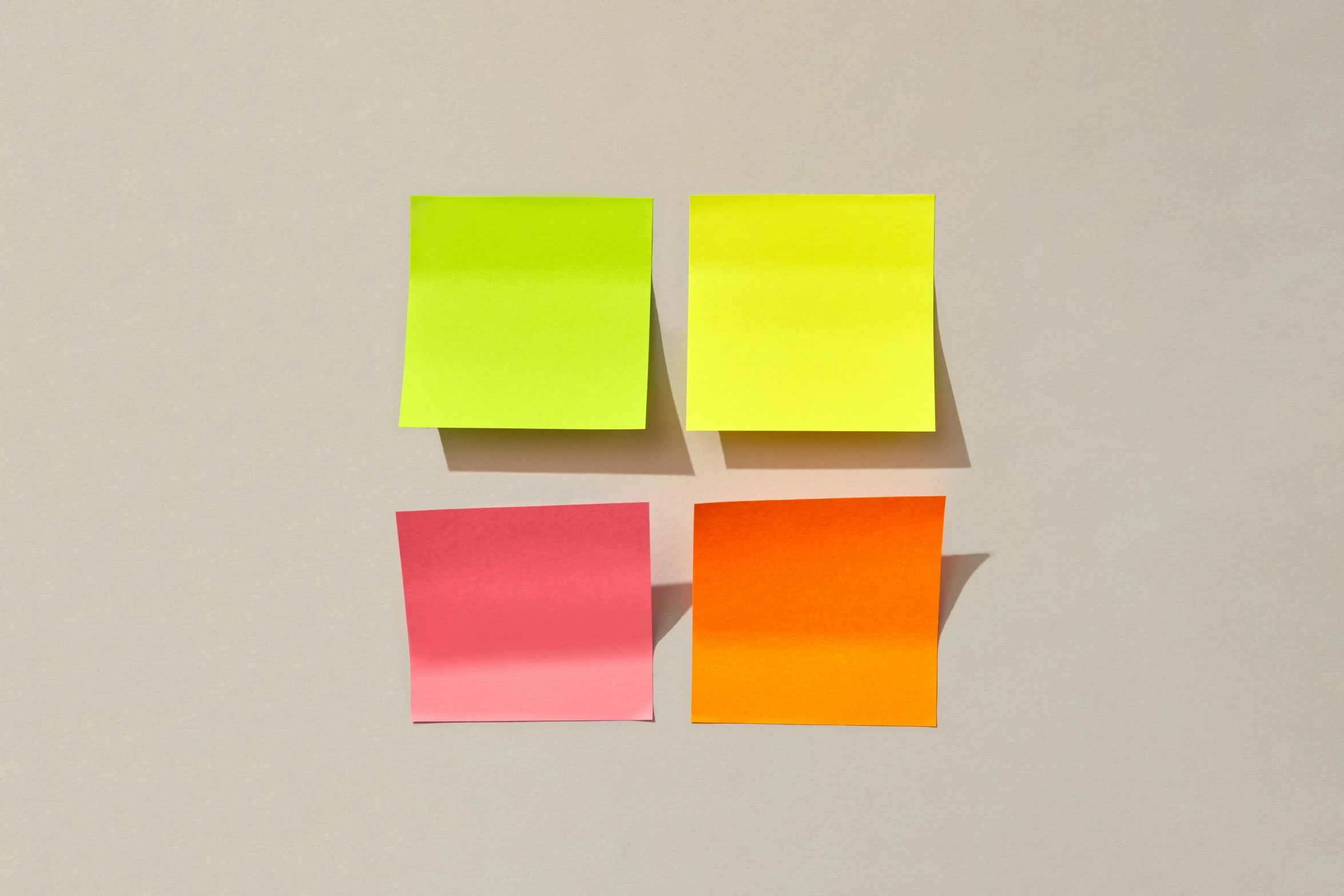 four pieces of paper arranged in different colors