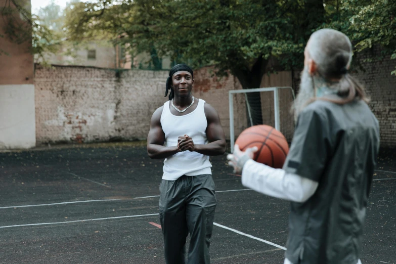 the man on the court has his hands together as if holding a basketball