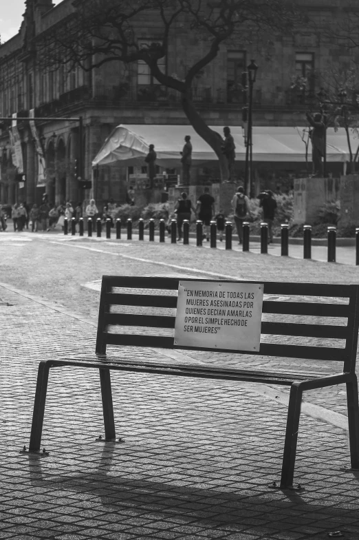 a park bench with a plaque on the back of it