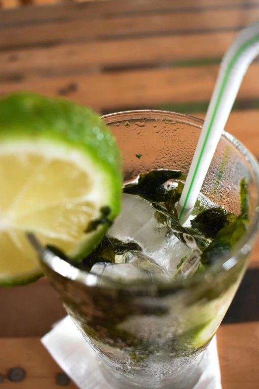 a close up of a cup with limeade in it