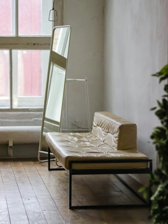 a white mattress sits next to a window