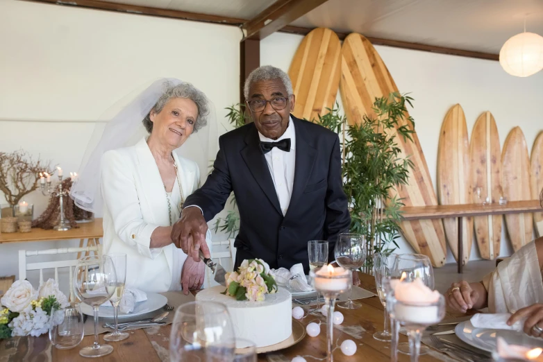 an older woman  a white cake at a wedding