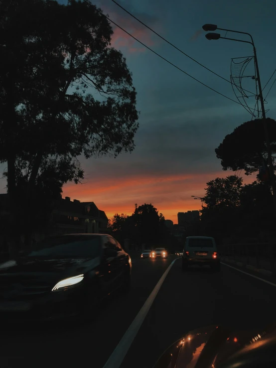 an image of cars driving on a highway at night