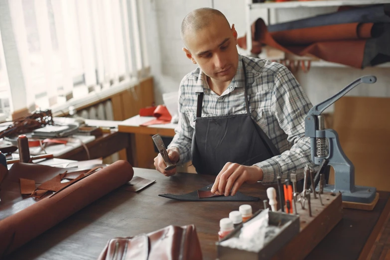 a man is working on some wooden items