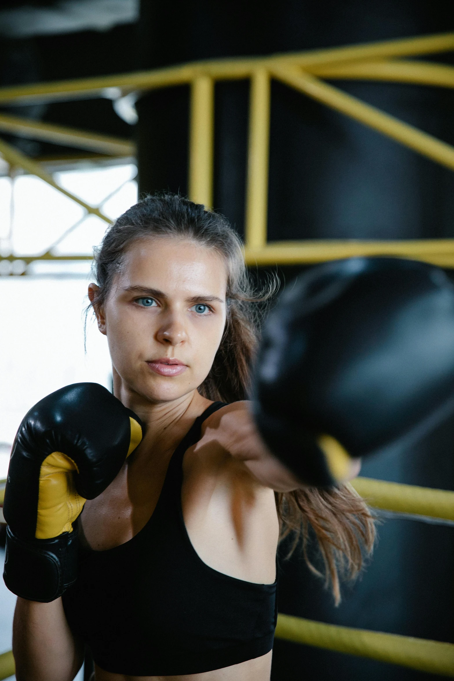 a female boxer poses for the camera