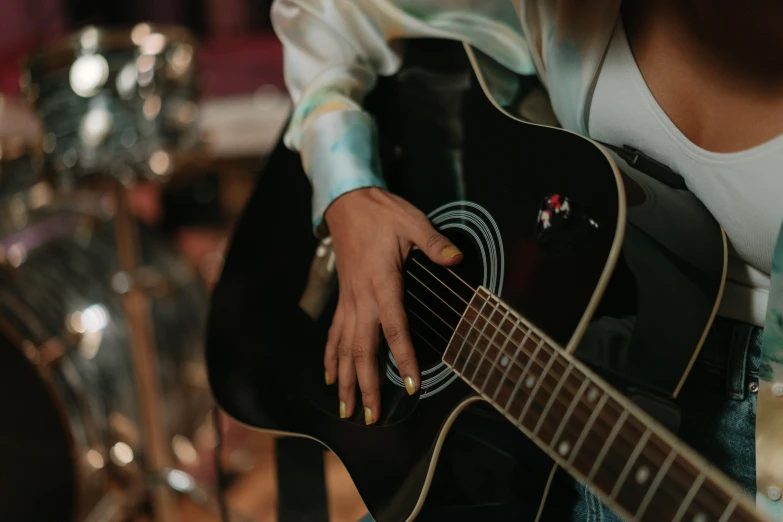 someone playing a guitar and some other items