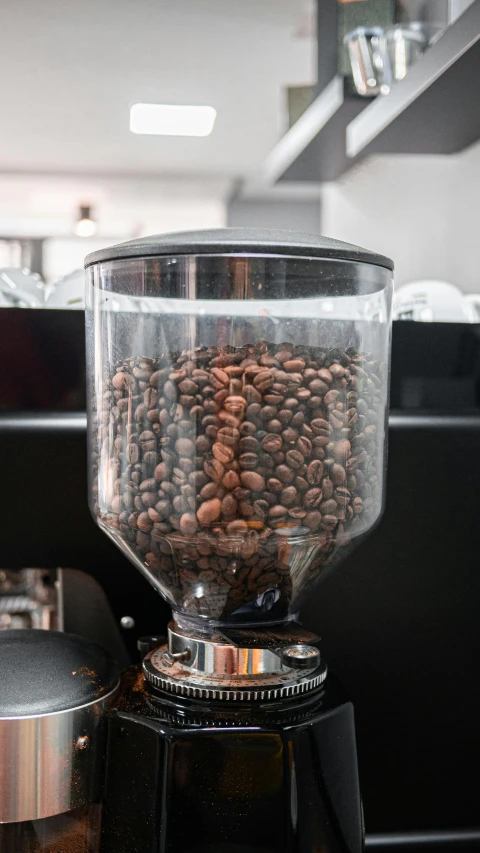 a close up of coffee beans on a coffee maker