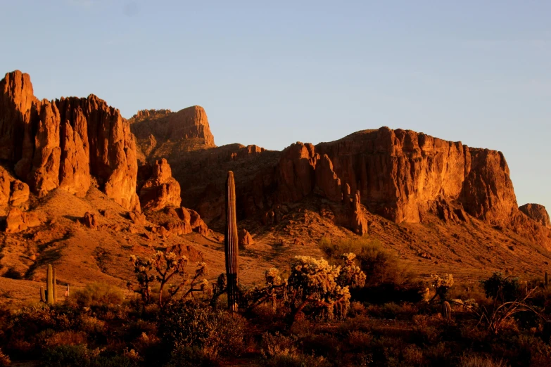 a large rocky mountain rising into the sky