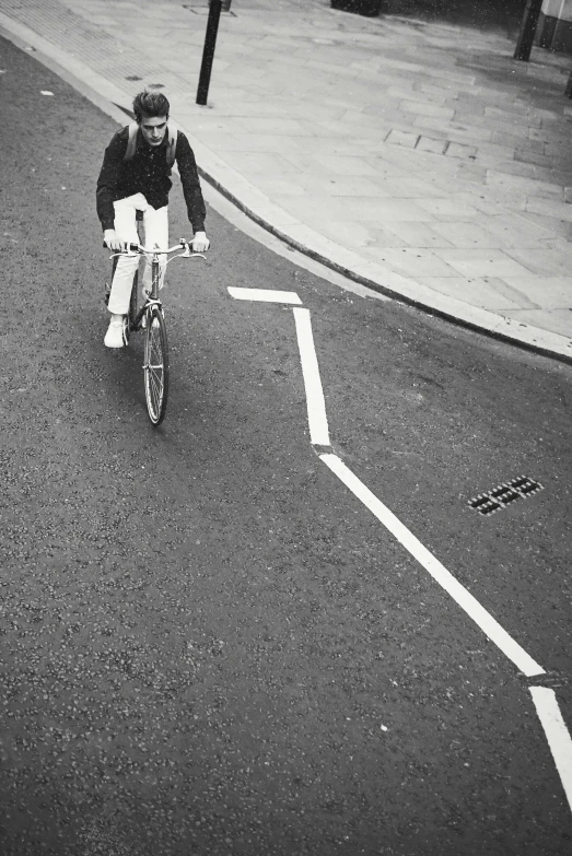 a man is riding his bike down the street