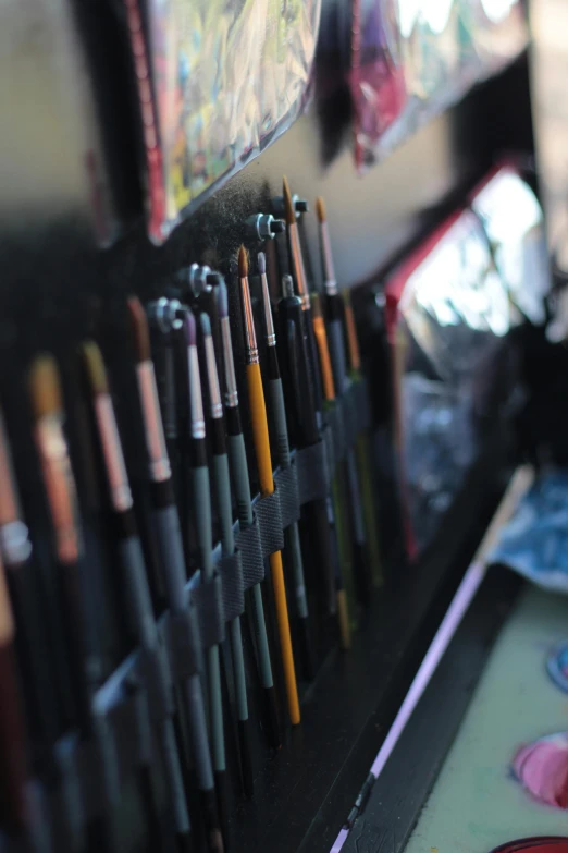 many pens sitting on top of a tray