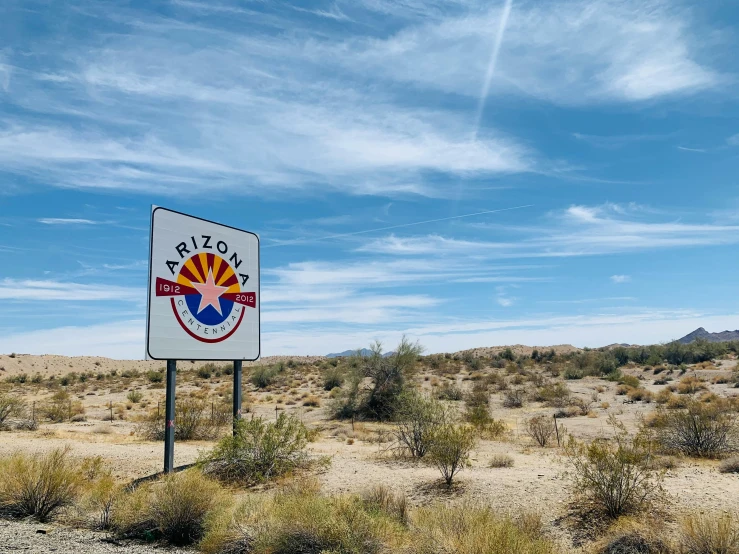 a sign is out in a desert