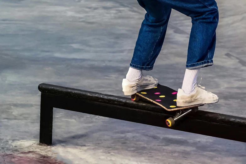 a person riding a skateboard on a rail