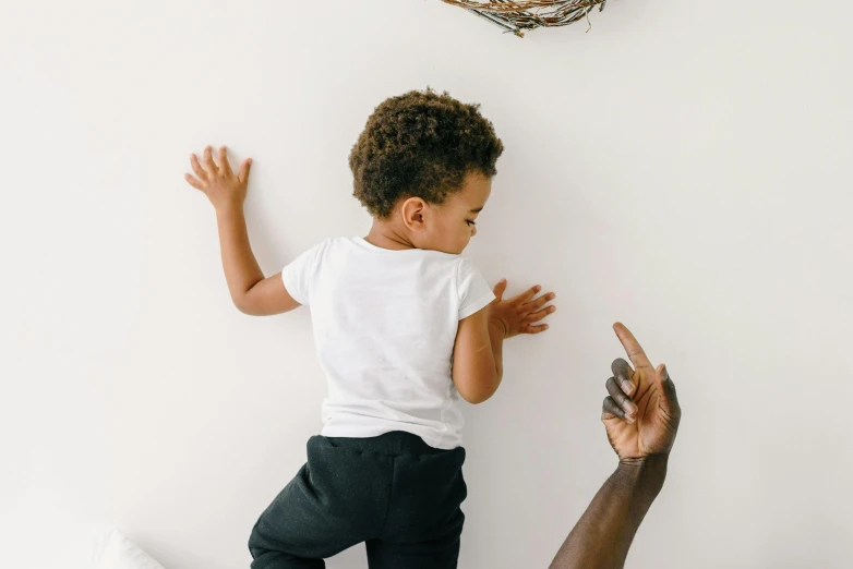 a toddler being held up by a man