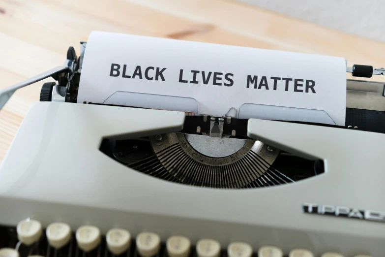 a black lives matter written on an old typewriter
