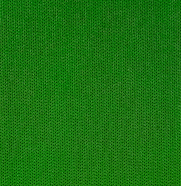 the bottom of a green cloth background that appears to be woven from different types of stitchs