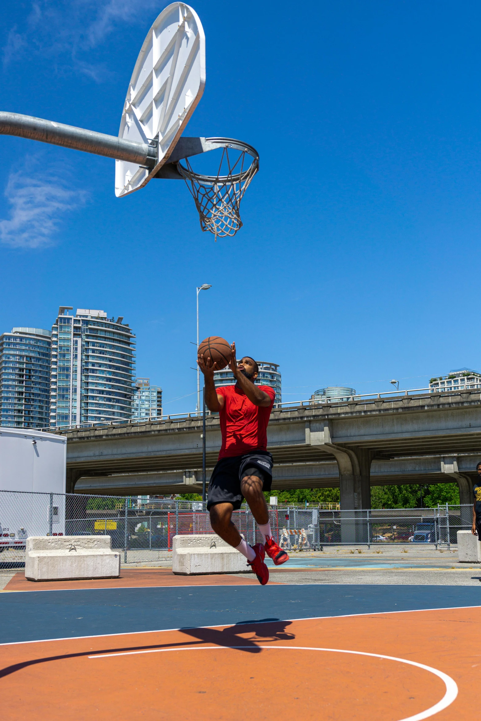 a man with a basketball jumping to dunk