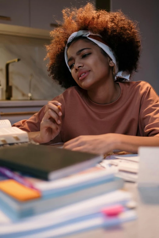 there is a woman sitting at a table working