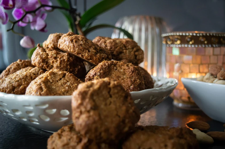 some cookies are on a table and some bowls