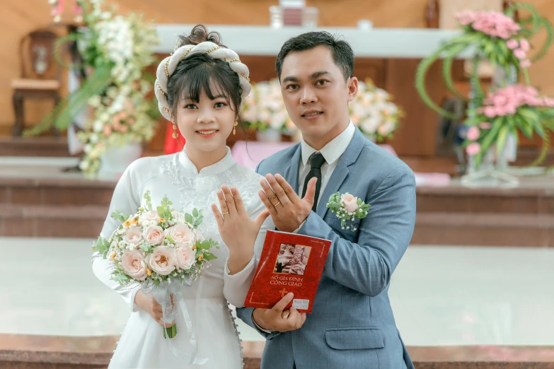 two people pose for a po before their wedding ceremony