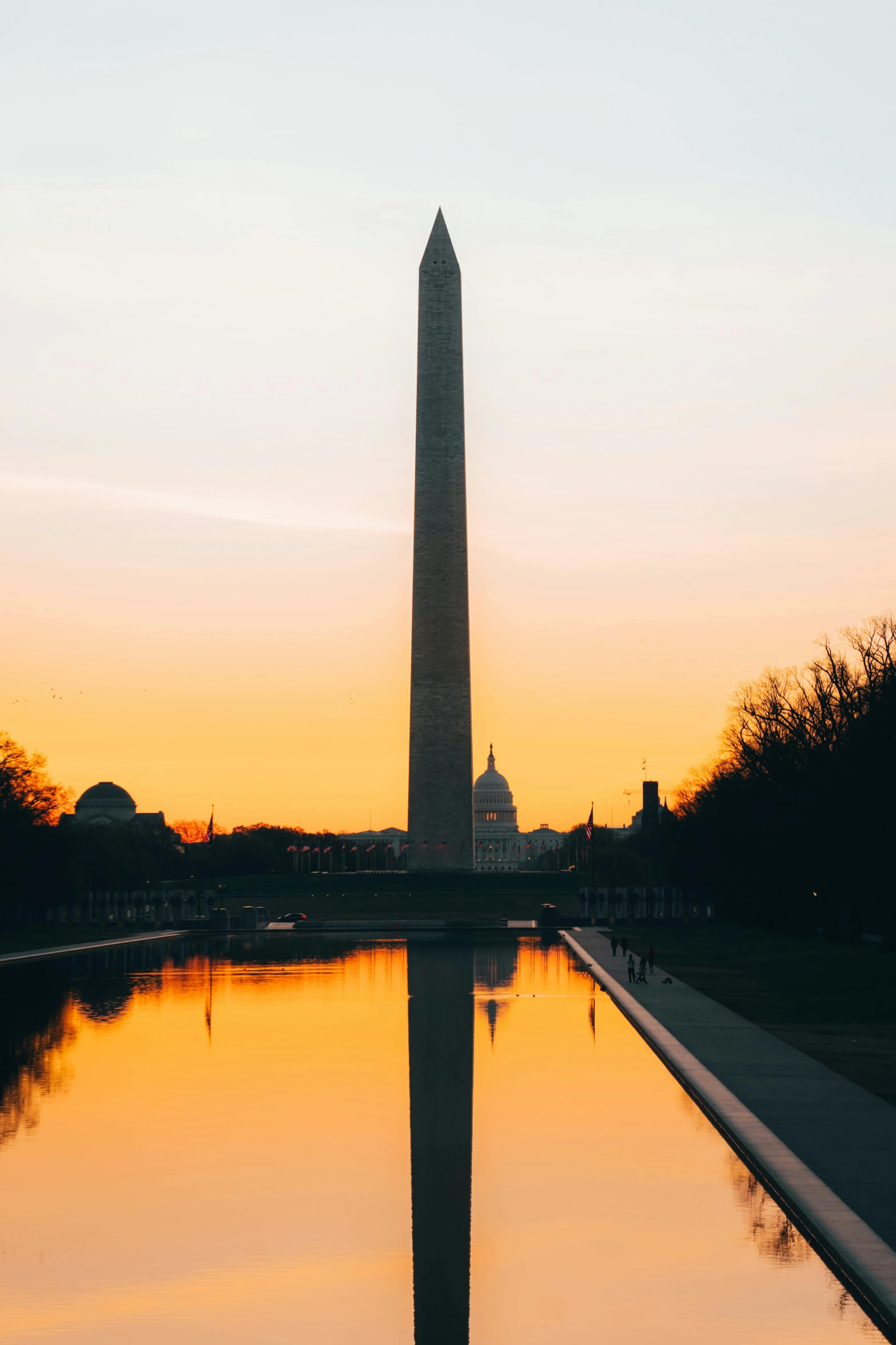 an image of the washington monument at dusk