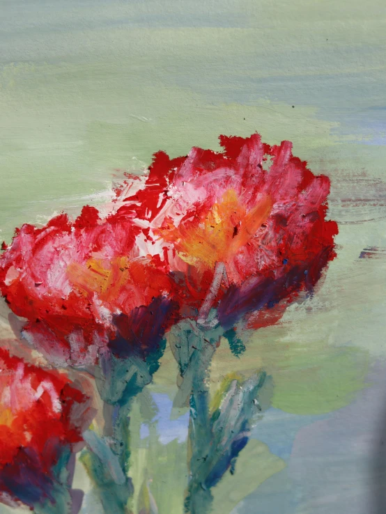a painting of red flowers in water on a wall