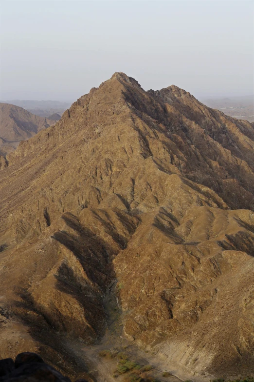 an image of mountains from the air that is brown